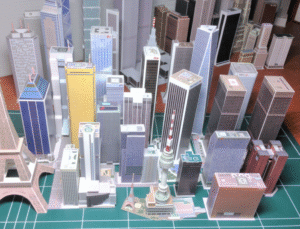 Miniature cityscape models representing Indore’s commercial skyline and property market